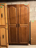 Front view of cabinet showing double doors and finish