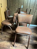 Front angled view showing five chairs stacked and one forward