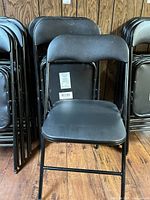 Front view of folded chairs showing overall design and quantity