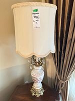 Full view of lamp showing shade, prisms, body and base