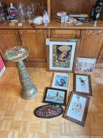 Group shot of pedestal and all framed pieces on floor