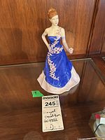 Front view of Royal Doulton HN4822 figurine in display case