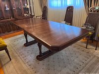Full view of dining table showing top surface and base