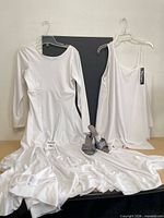 Dress, tunic top, glitter sandals displayed together