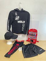 Full lot showing hoodie, shorts, leggings, cap and London bus backpack