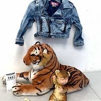 Jacket hung with tiger and cub displayed, lot overview