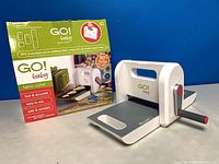 Retail box front and fabric cutter side view