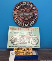 All three metal signs displayed together