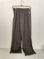 Full view of front of wool slacks on hanger