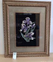 Full view of framed ceramic floral artwork