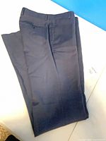 Full view of navy dress slacks folded