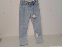 Front view of new Blue Willi's light blue stretch jeans with tag