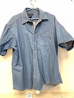 Front view of Denver Hayes denim shirt on hanger