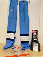 Full lot showing AK socks, empty packaging, and sealed skate laces
