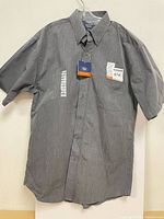Front view of grey Denver Hayes short-sleeve shirt on hanger