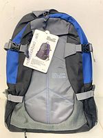 Front view of blue and gray Flip Xtreme backpack with retail hang tag attached
