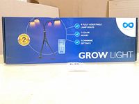Front of box showing Everlasting Comfort grow light, tripod image and feature list