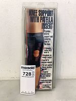 Front view of sealed package showing product name Knee Support with Patella Insert and size Large