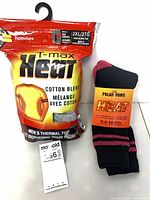 Packaged T-Max Heat thermal top with Polar Paws socks and lot tag