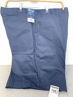 Front view of navy shorts showing tag and size label