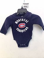 Front view of navy long-sleeve baby onesie with Montreal Canadiens logo and snap crotch