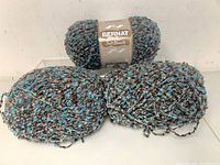 Three Bernat Soft Bouclé skeins front view