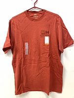Front view of burnt orange WindRiver T-shirt with tag attached