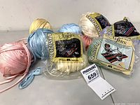 Overview of eight yarn balls including packaged units