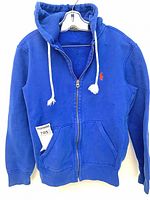 Front view of royal blue Ralph Lauren hoodie showing zipper, drawstrings, red logo and pocket