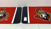 Two identical red and black Ottawa Senators floor mats laid side by side showing logos and edge binding