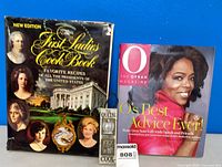Front view of both books and ornament showing titles and cover art