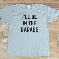 Full front view of heather grey T-shirt showing overall condition and graphic