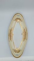 Full view of elongated Noritake dish showing overall shape, handles and gold decoration