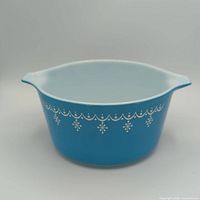 Side view of blue Snowflake Pyrex casserole dish