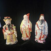 Front view of three porcelain figurines