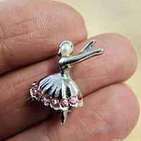 Front view showing ballerina shape, faux pearl head, pink rhinestones