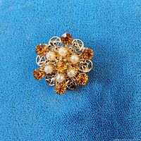 Front view of brooch showing overall design and stones