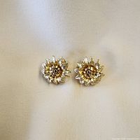 front view of both gold-tone sunflower earrings