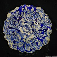 Top view of blue floral scalloped plate