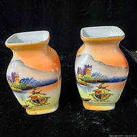 Front view of both Noritake vases showing painted scene and crest
