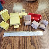 All nine furniture pieces with ruler for scale