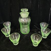 full view of decanter and six glasses