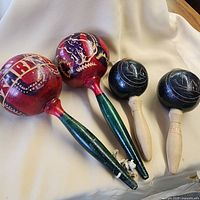 Group view of all four maracas showing colors and designs