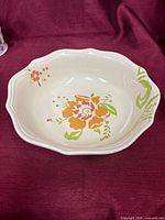 Inside view showing floral design and scalloped rim