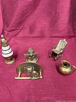 All five brass items displayed