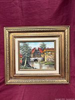 Front view of framed signed landscape oil painting