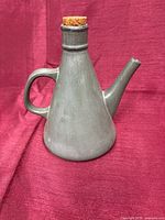 Full view of gray pourer with cork stopper