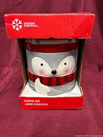 Front view of boxed Everyday Essentials cookie jar showing animal design through open front