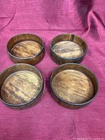 Top view of four shallow wooden bowls