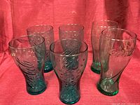 All six Coca-Cola embossed glass tumblers grouped